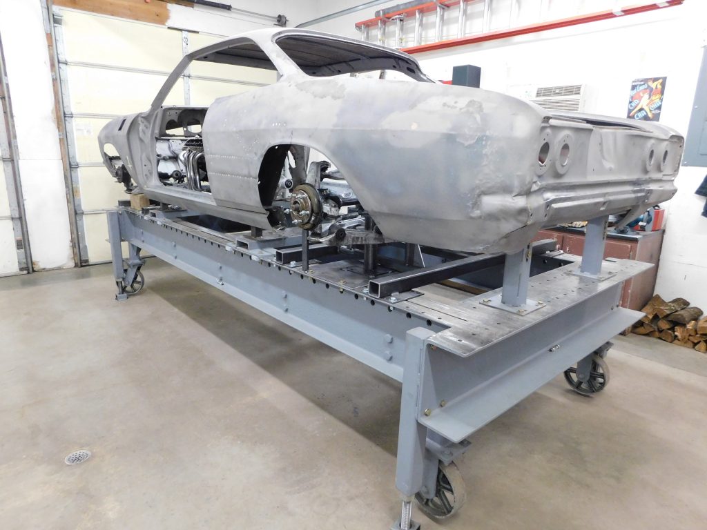 A car is being built on the rolling table.