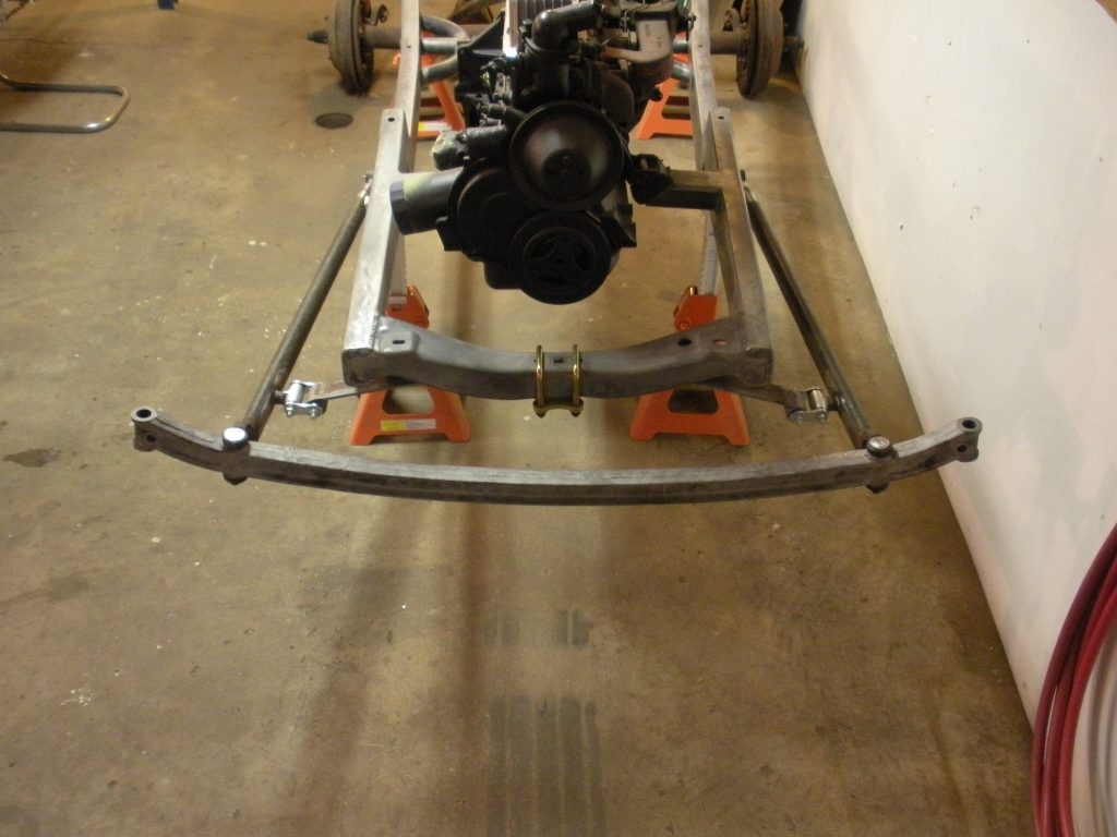 A car frame with the front end in place.