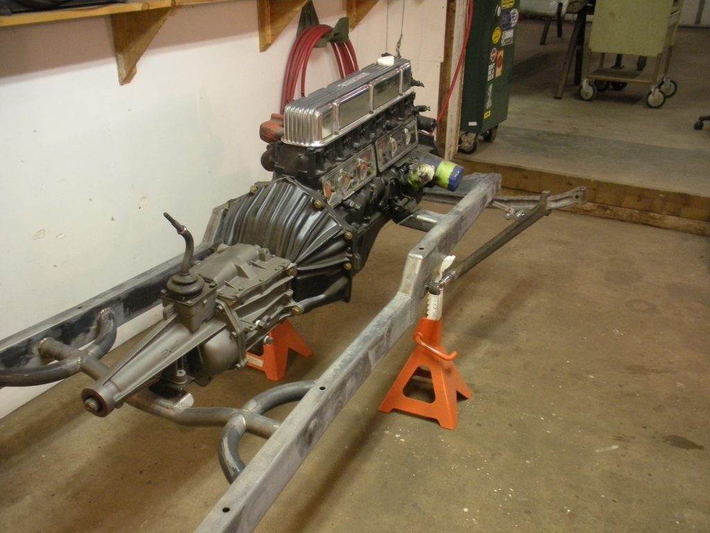 A car engine sitting on top of a stand.