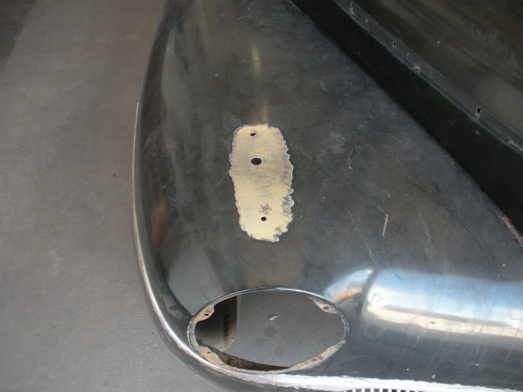 Damaged car fender needing repair.