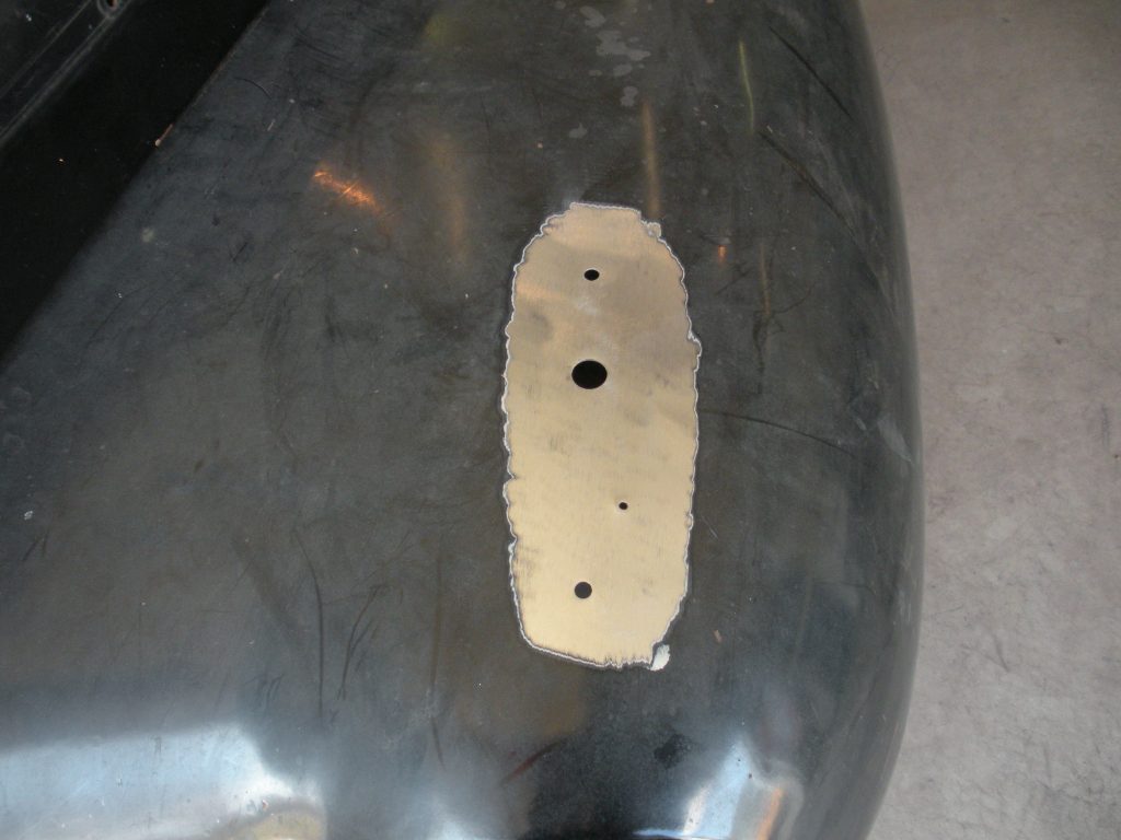 Car body panel with cut-out plate.