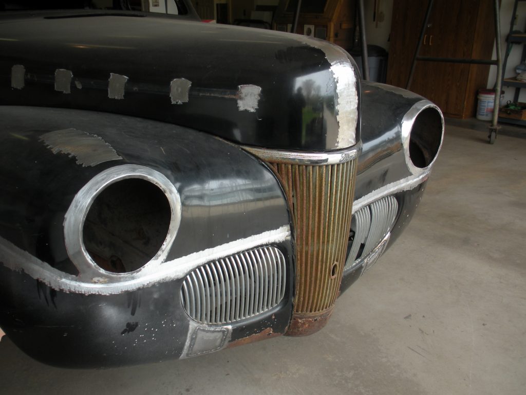 Black vintage car front end restoration.