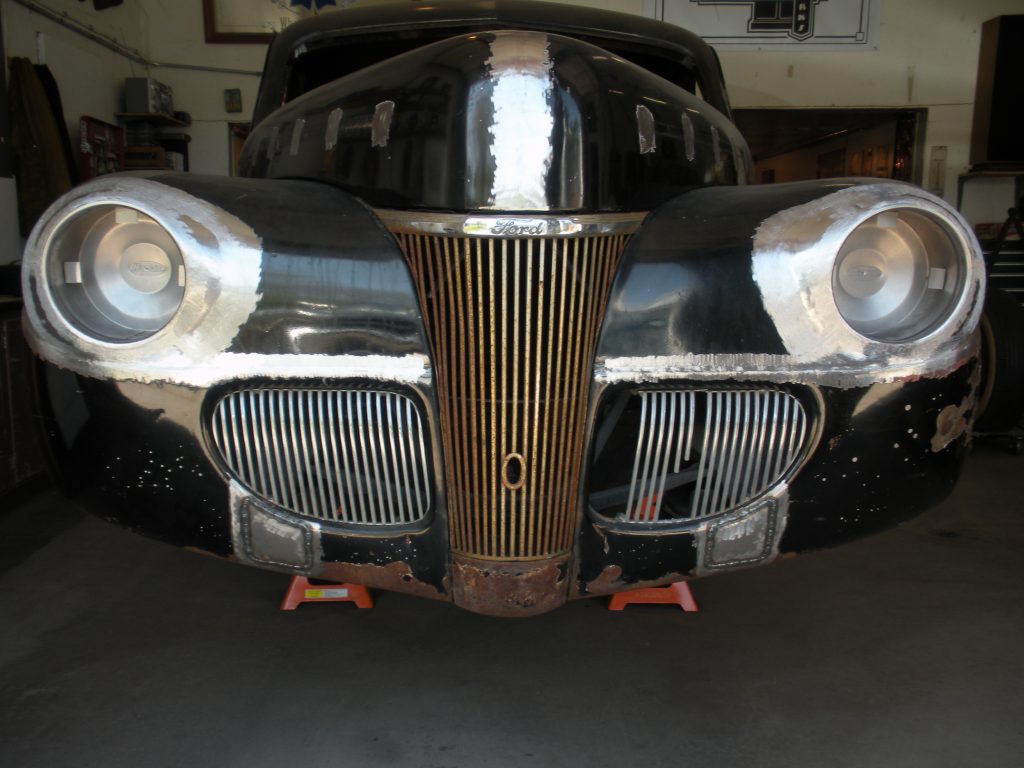 Black Ford car, under restoration.