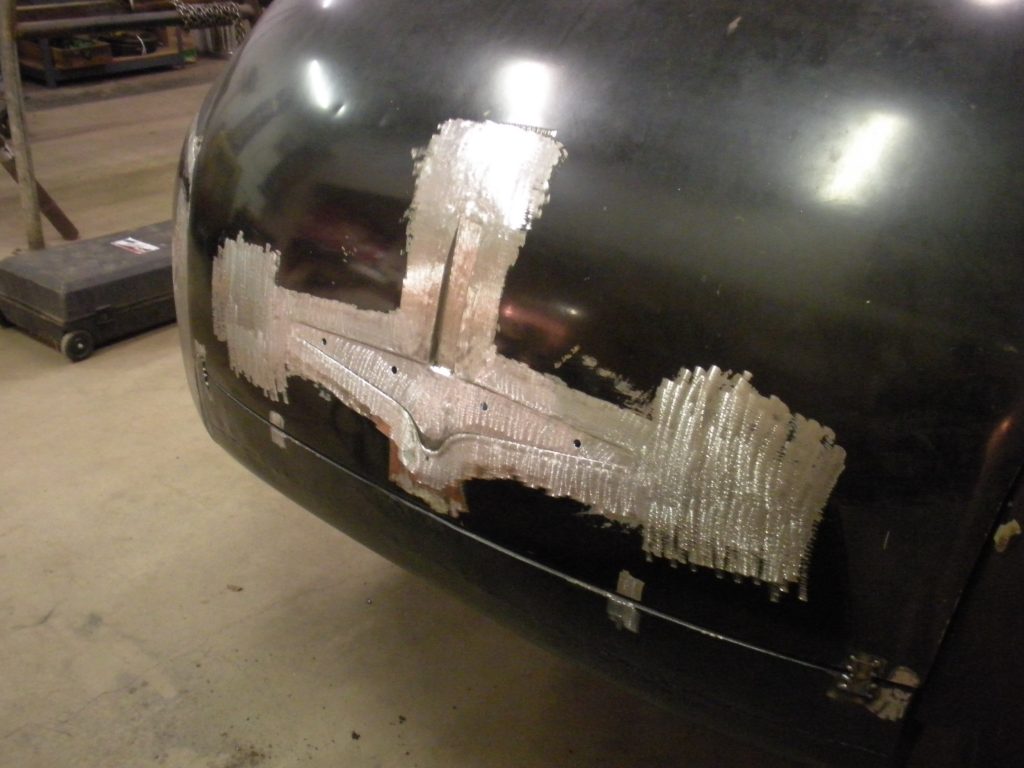 Car body repair, metal patch welded.