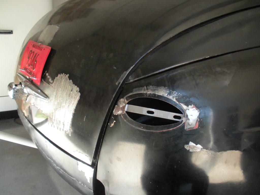 Black classic car body repair.