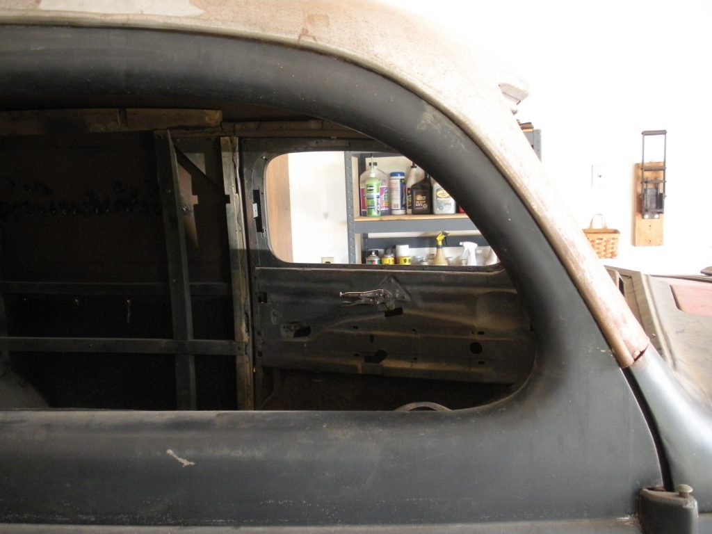 A view of the back window from inside an old truck.