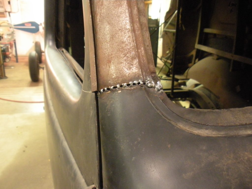A car door with some metal strips on it
