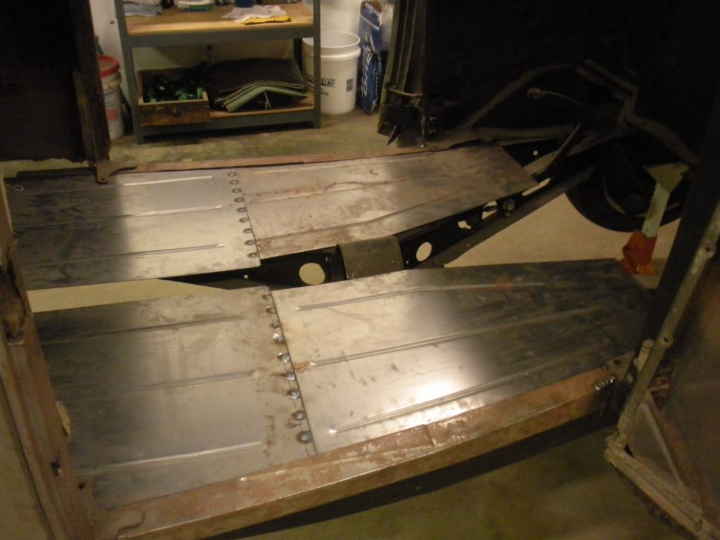 A pair of ramps in the middle of a garage.