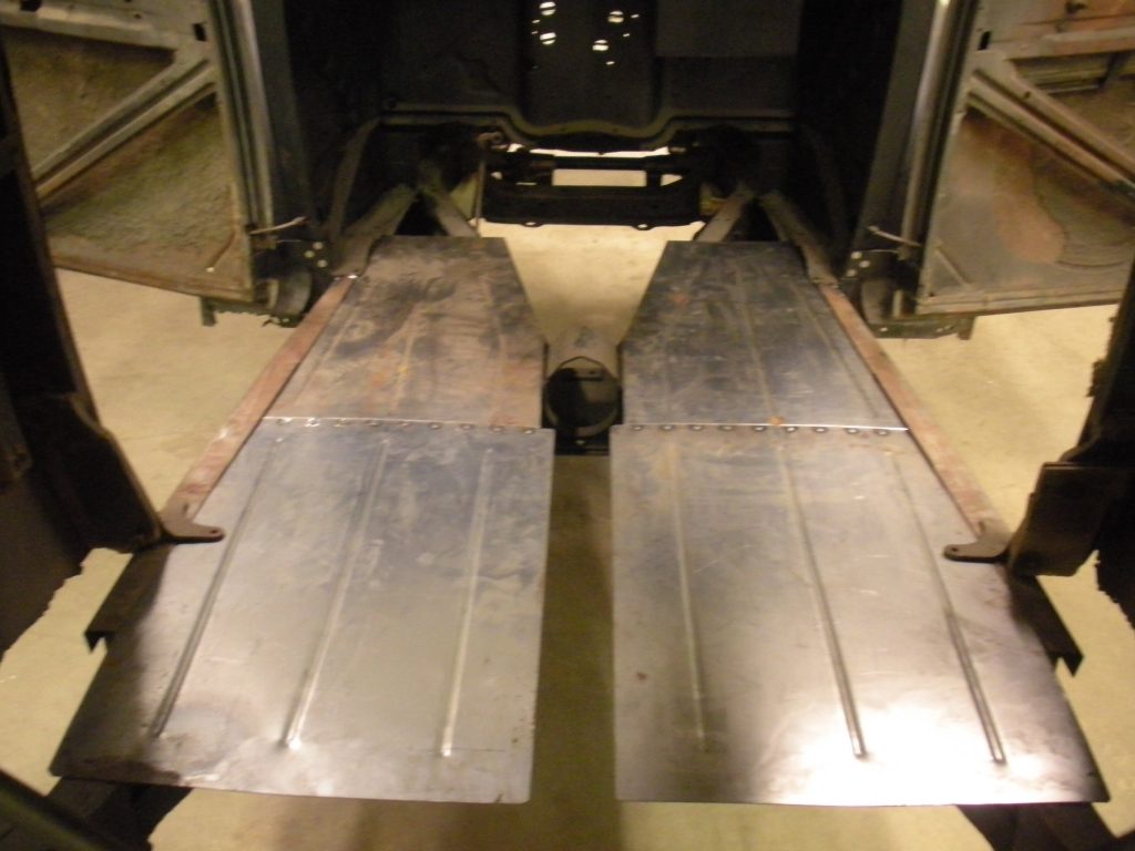 A pair of metal ramps on the floor.
