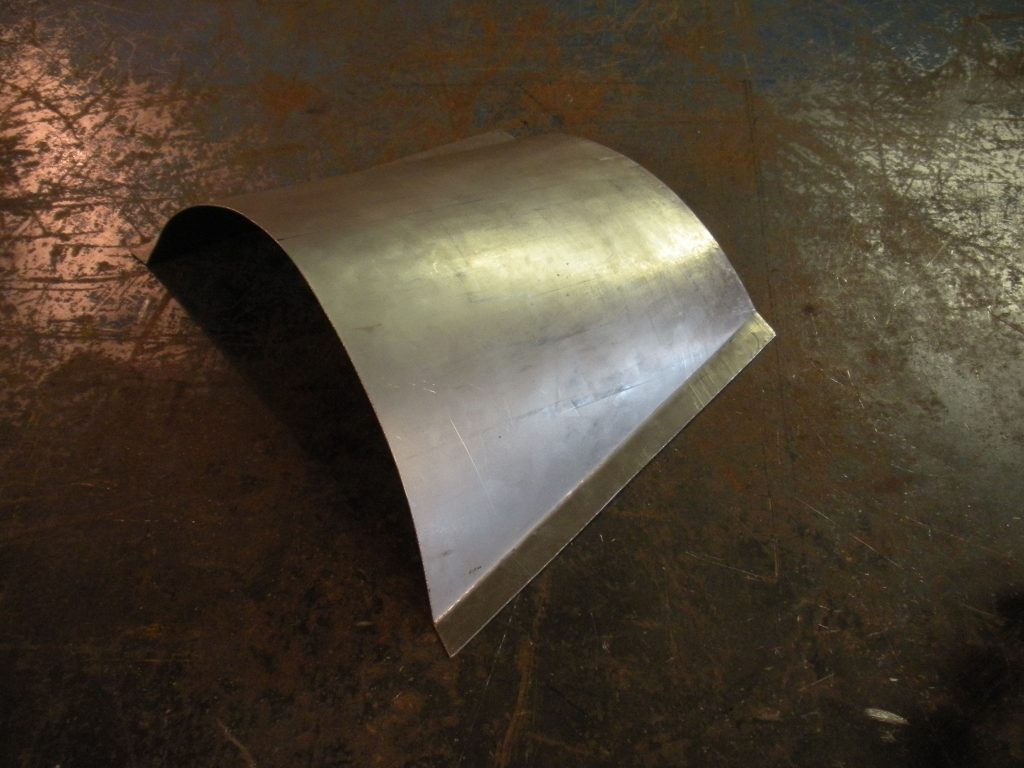 A metal object sitting on top of a floor.