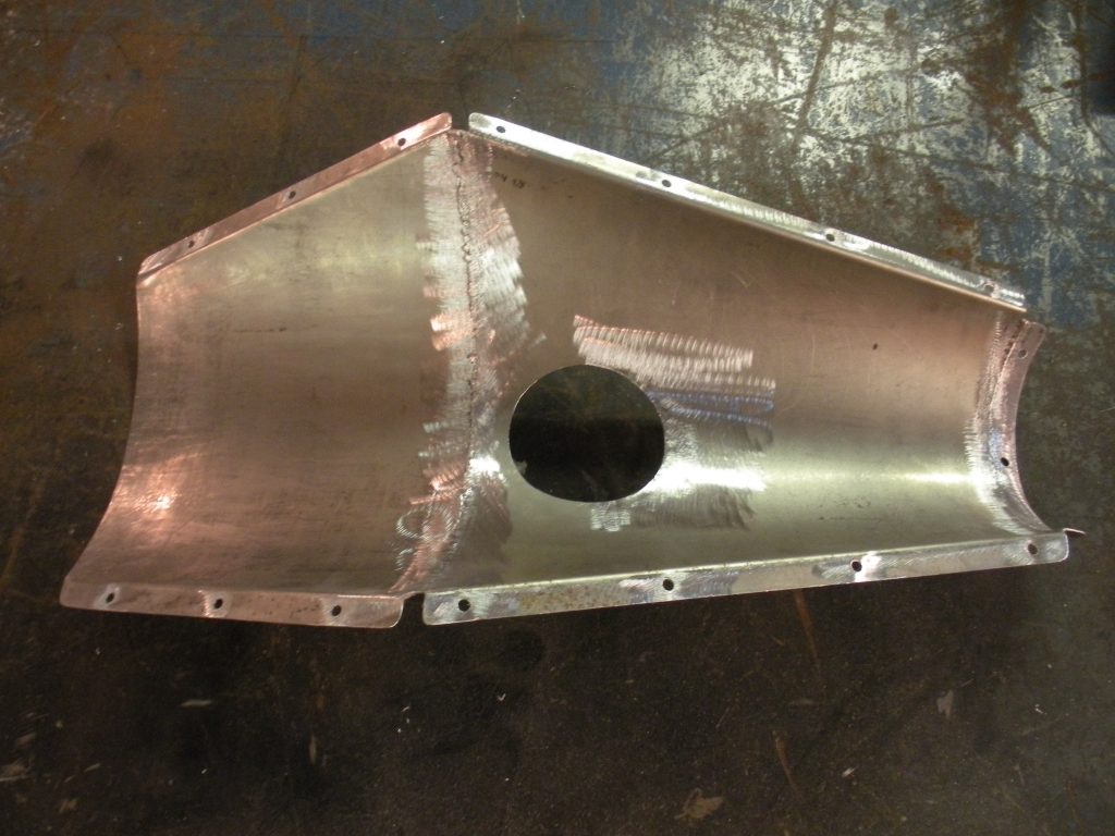 A metal piece of construction that is being worked on.