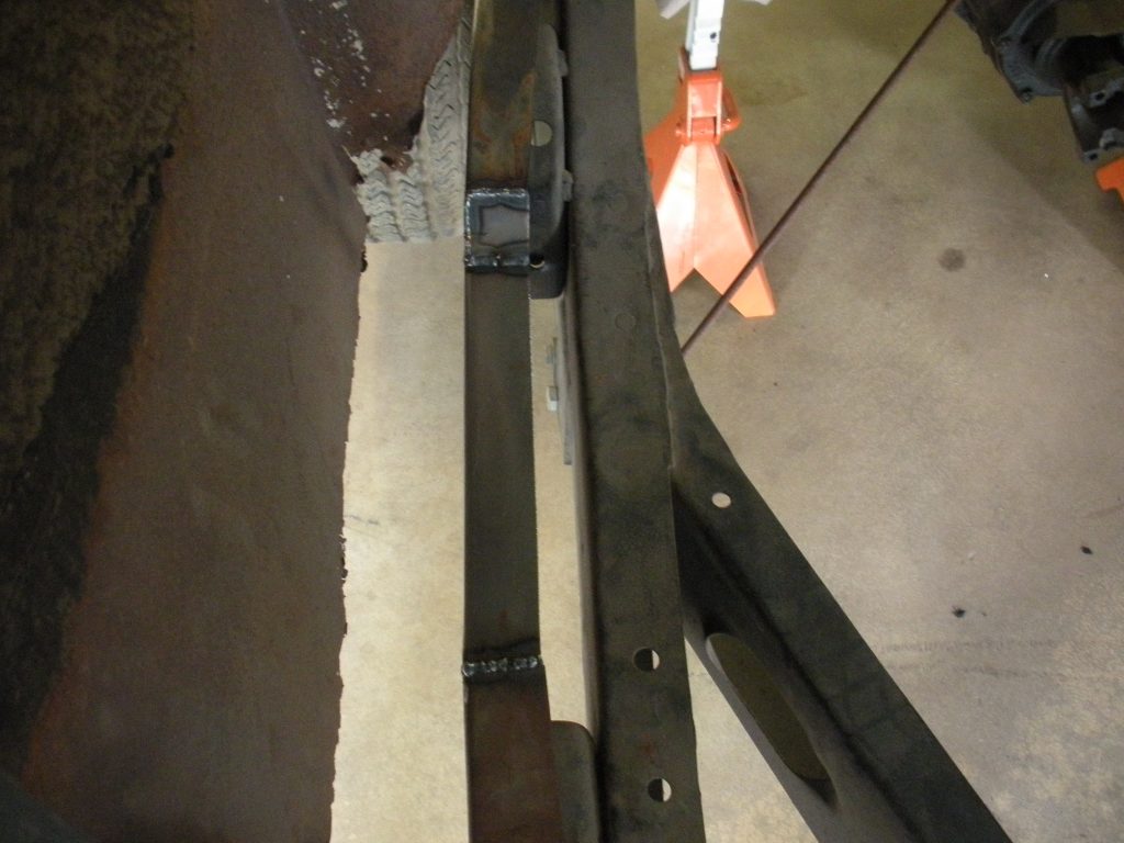 A metal beam sitting on top of the floor.