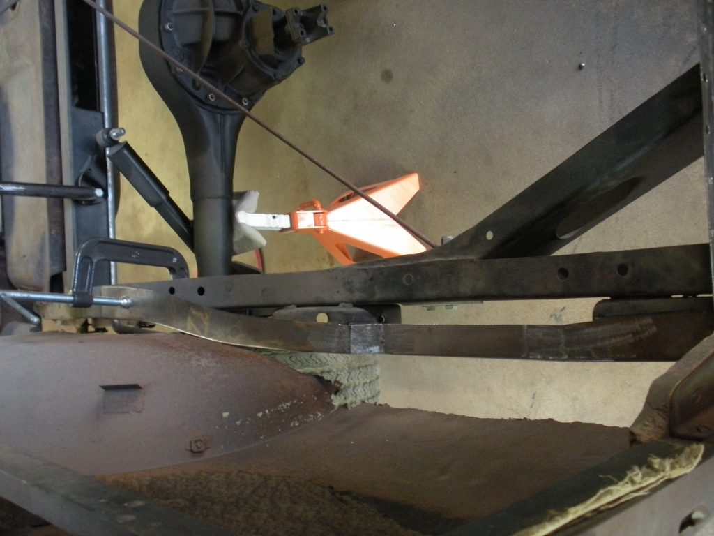 A close up of the bottom part of an industrial machine.