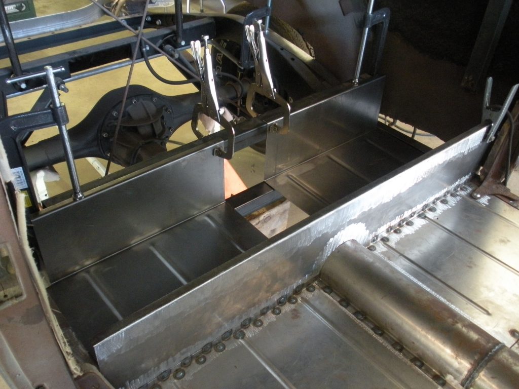 A metal tray on top of a machine.