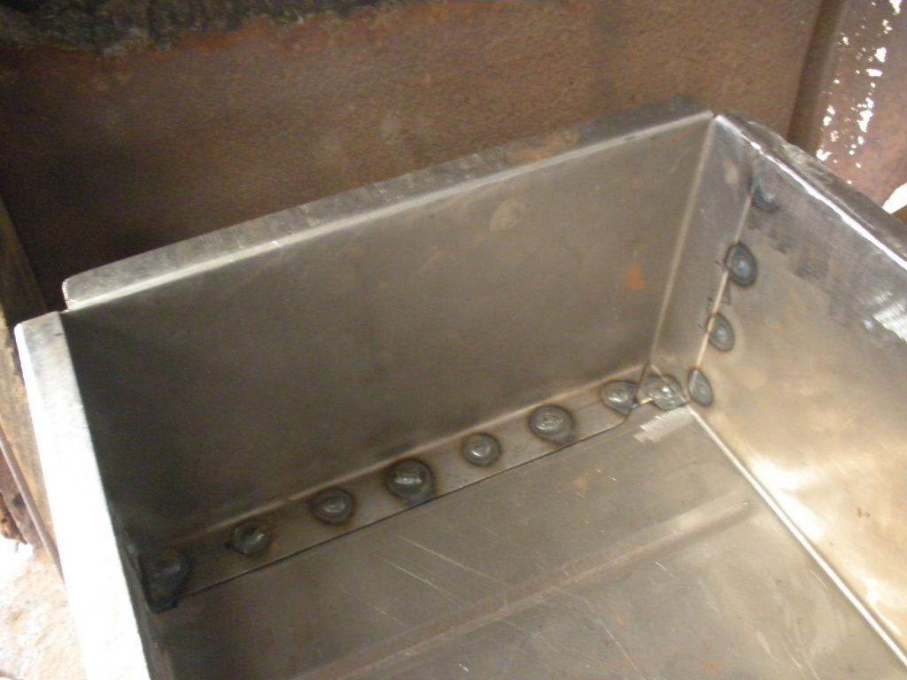 A metal box with holes in it