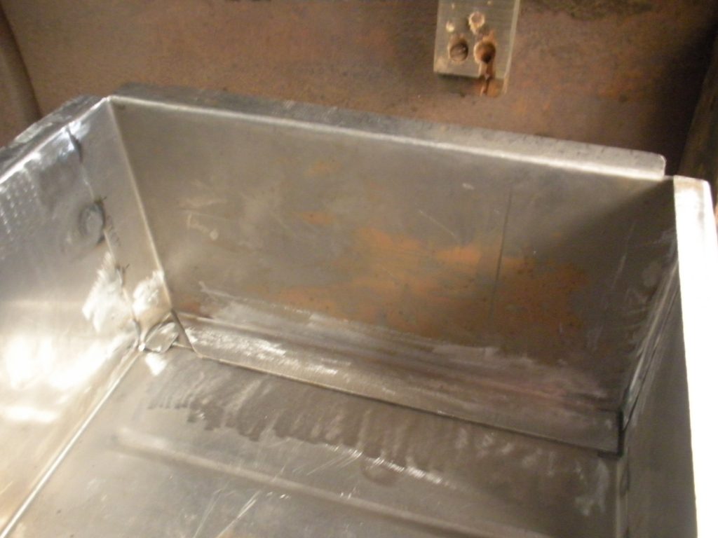 A metal box with some rust on it