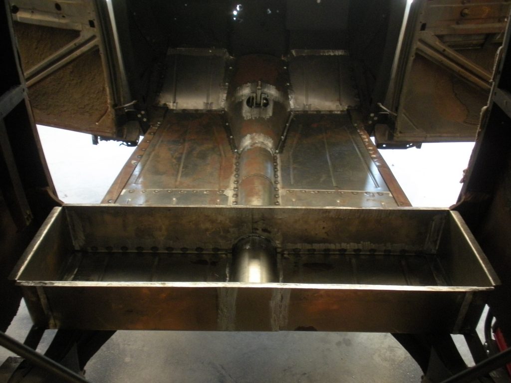 A large metal machine with some holes in it