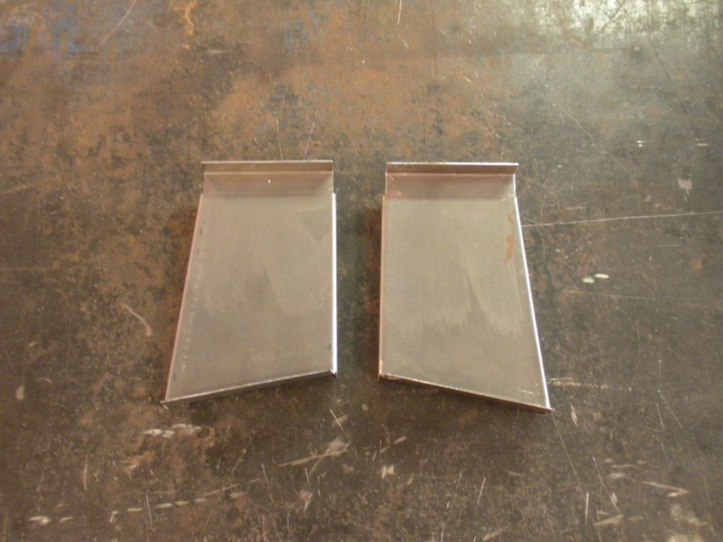 A pair of metal plates sitting on top of a table.