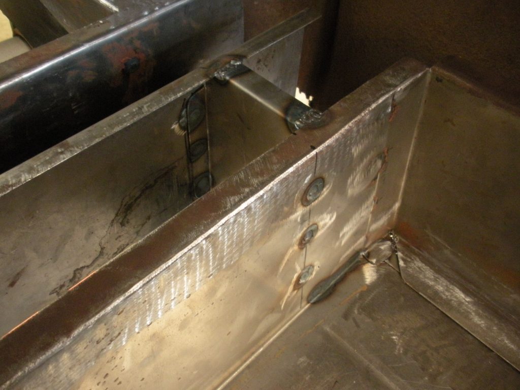 A metal structure with some holes in it