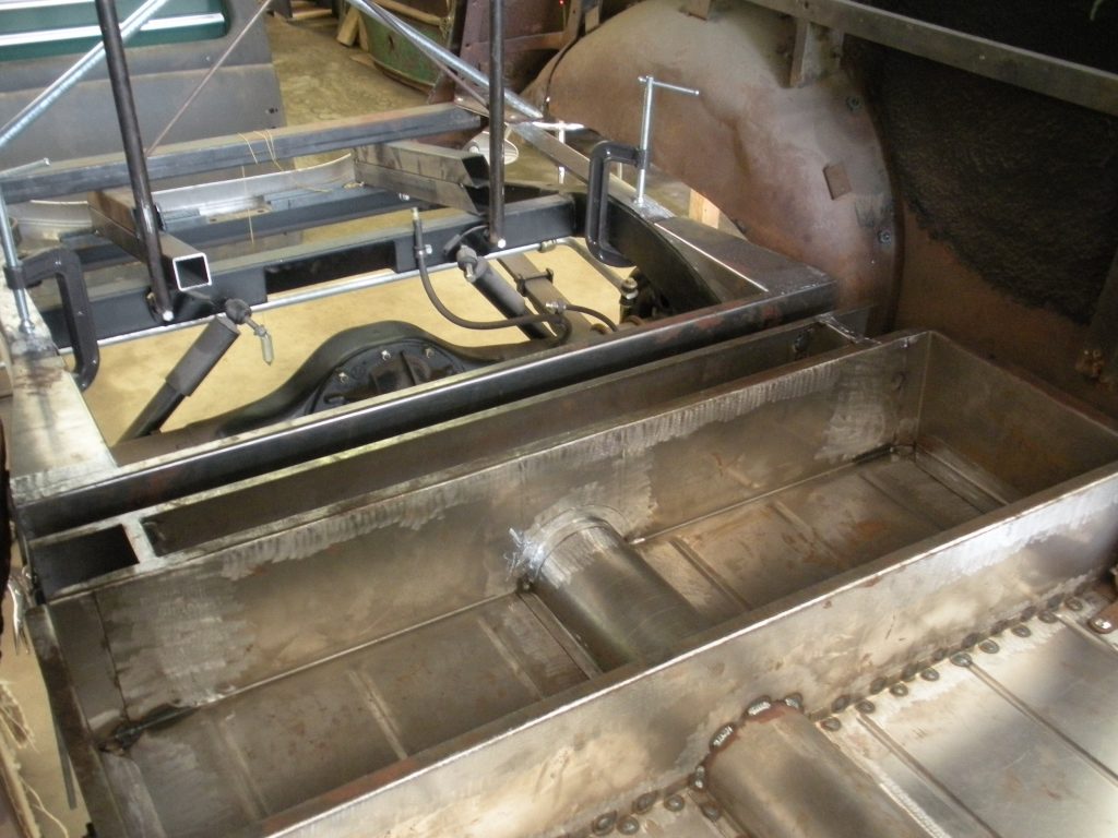 A large metal machine with some parts in it