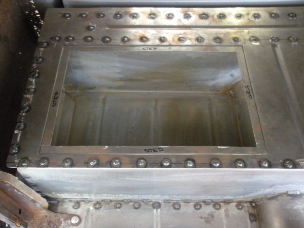 A metal box with rivets on it
