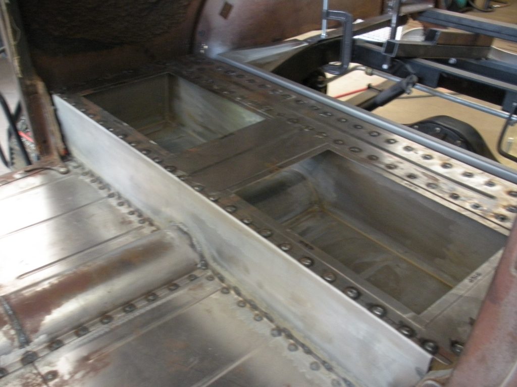 A metal piece of art is shown in the process.