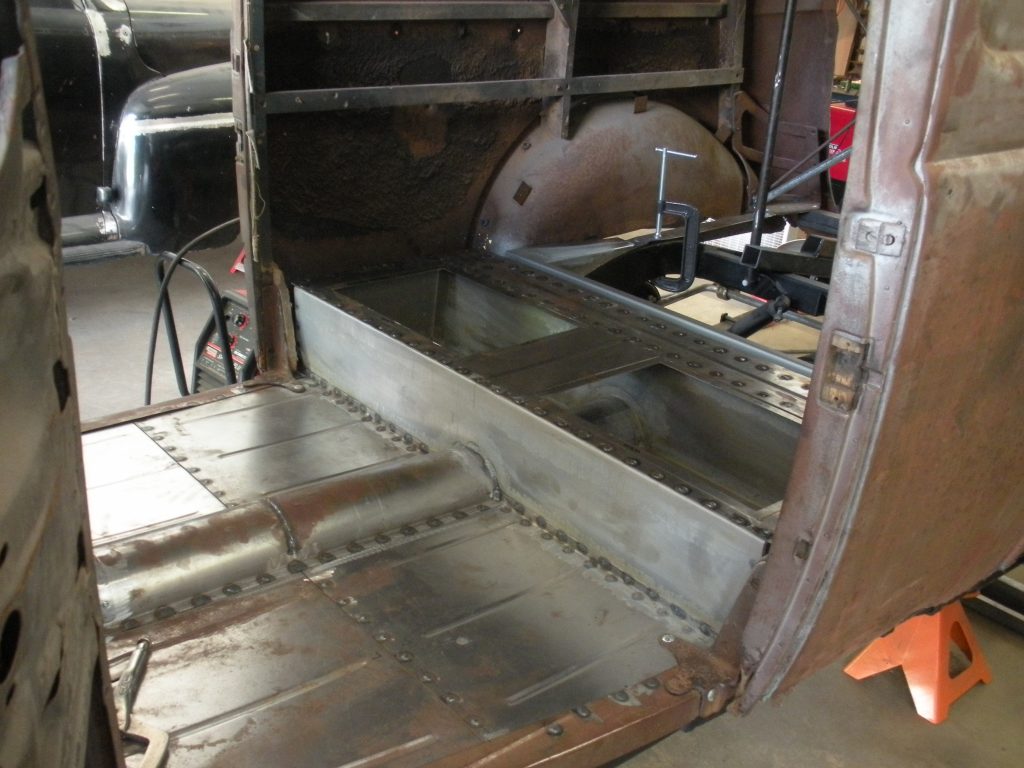 A large metal box with a sink in it.