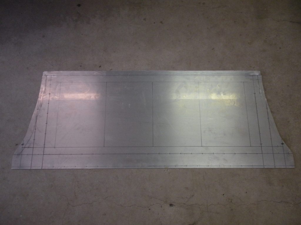 A metal sheet sitting on top of the floor.