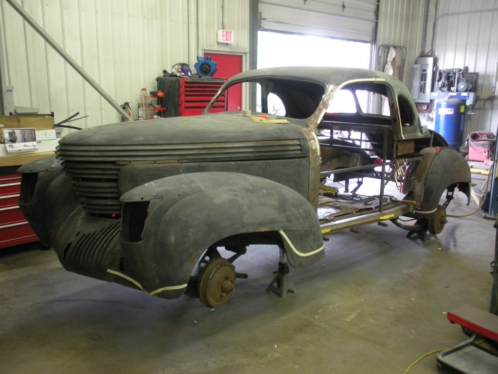 A car that is being worked on in the shop.