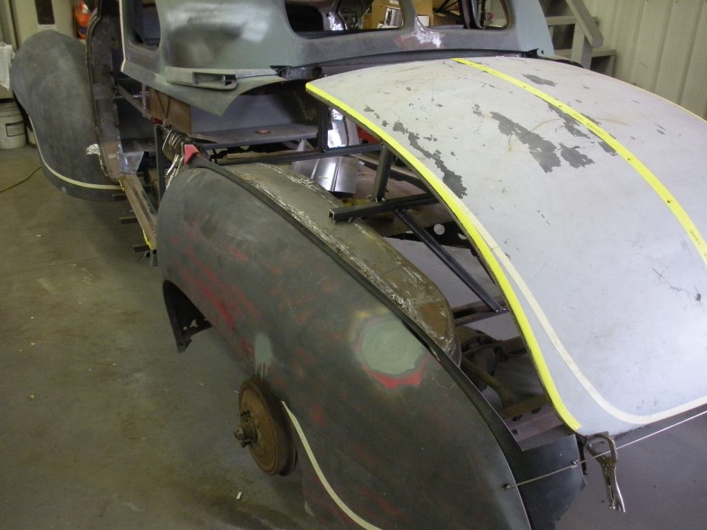 A truck that has been stripped of its paint.