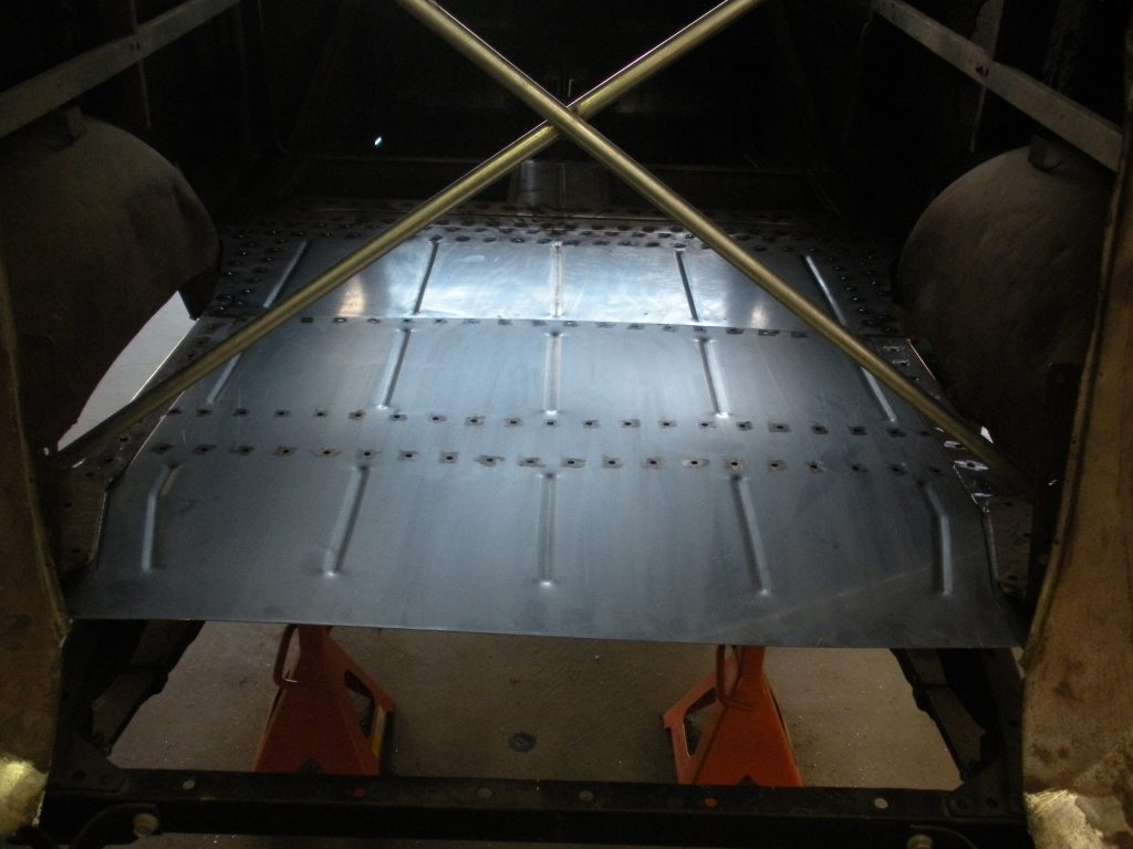 A view of the bottom of an airplane.