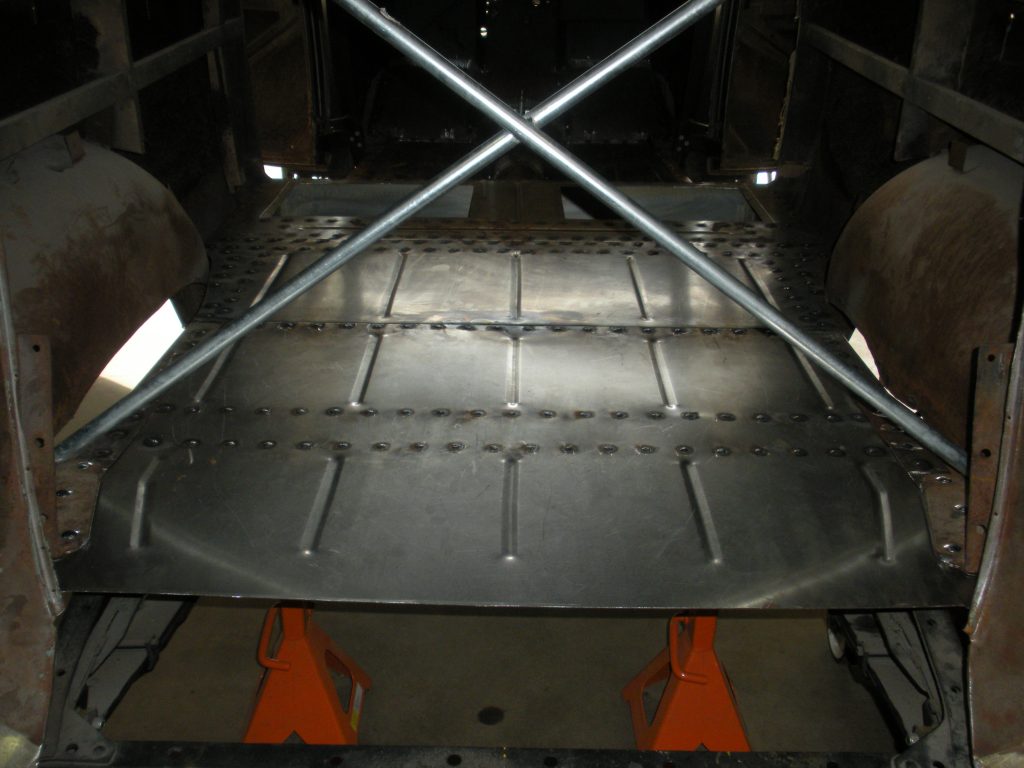 A metal structure with orange traffic cones on top of it.