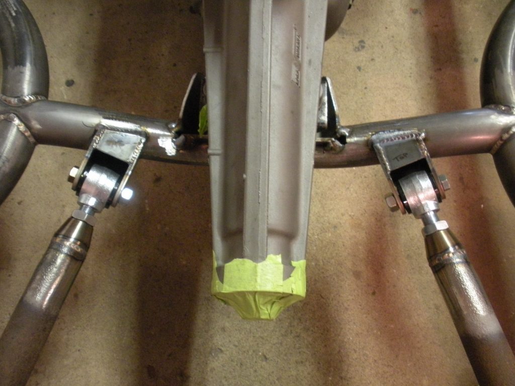A close up of the bottom part of a bicycle.