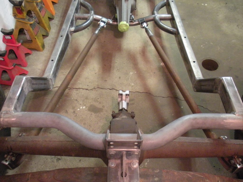A metal frame with two wheels attached to it.
