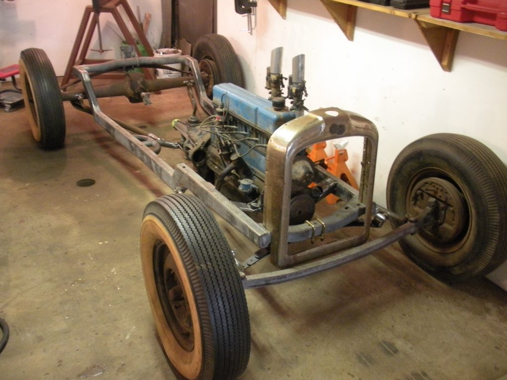 A car that is being worked on in the garage.