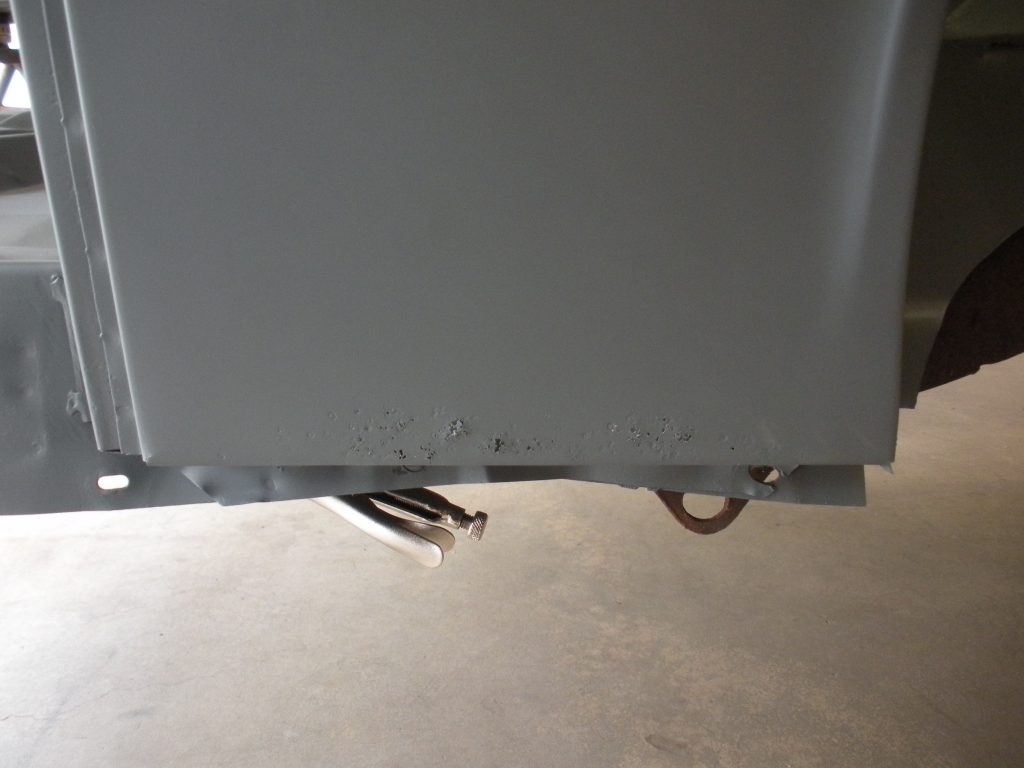 A close up of the bottom of a refrigerator