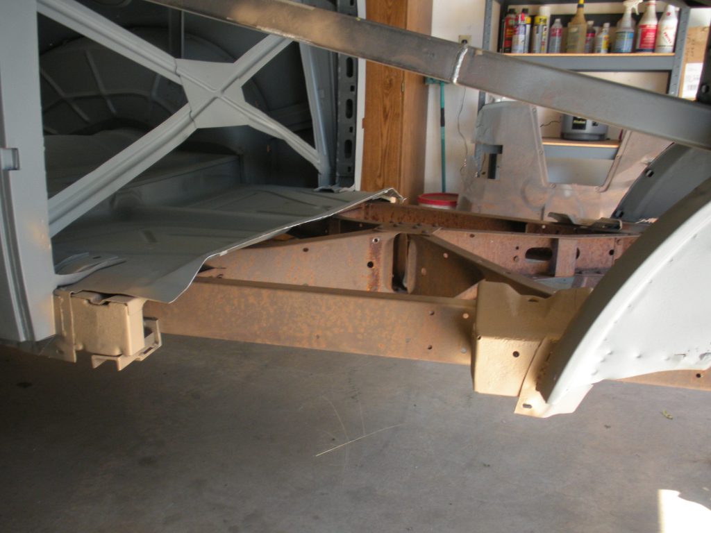 A wooden frame with some metal parts on it
