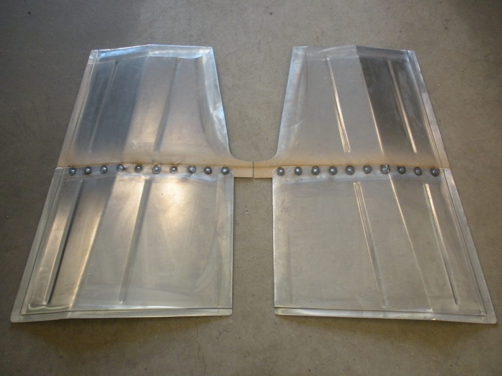 A pair of plastic trays with dividers on top.