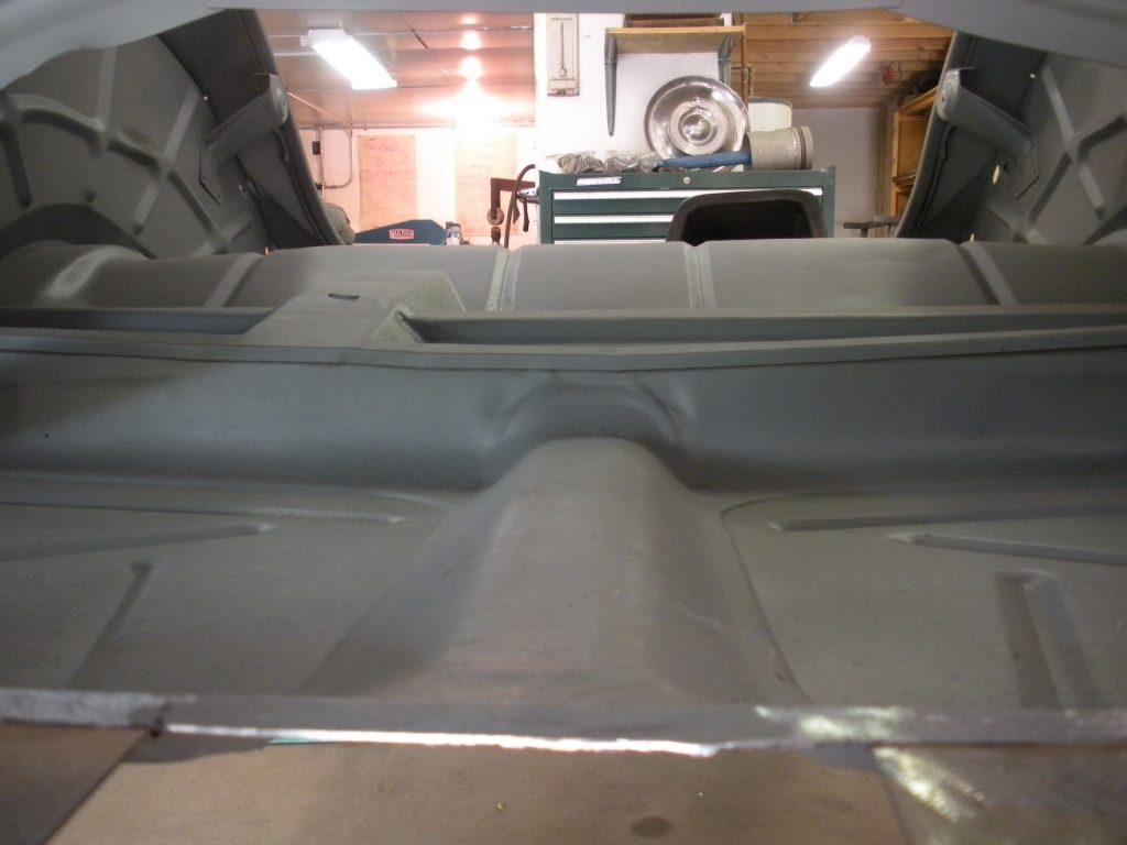 A view of the back end of an old car.