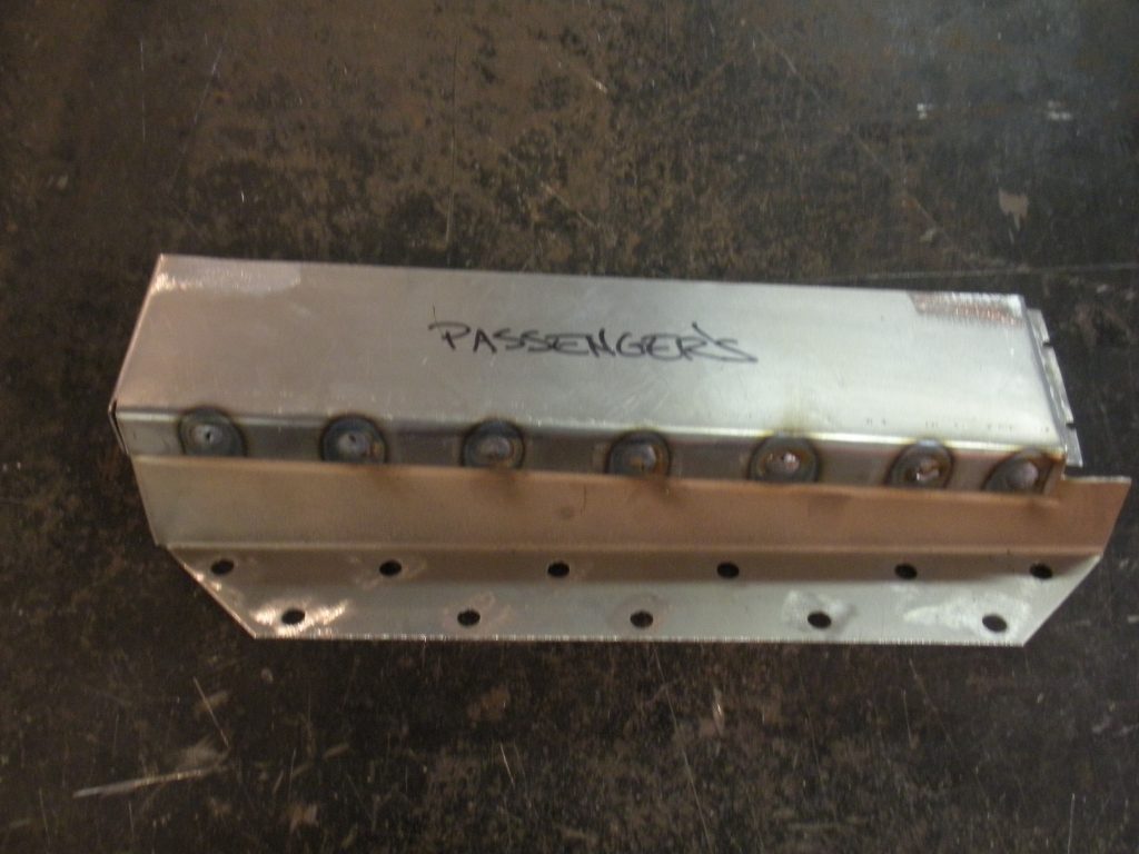 A metal piece of equipment with some writing on it