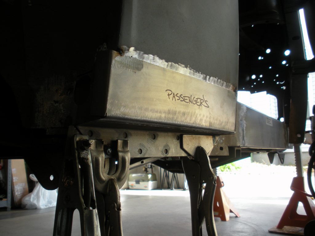A close up of the underside of an airplane.
