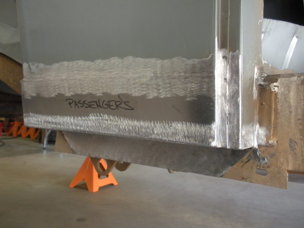 A metal piece of art is being constructed.