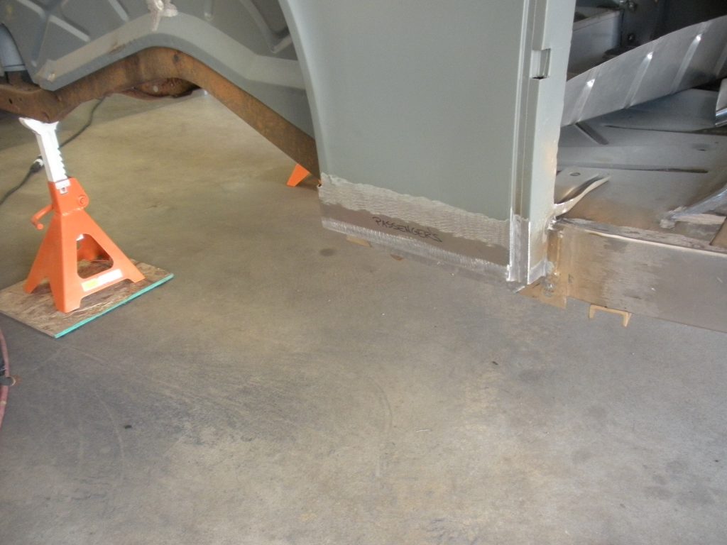 A floor that has been partially covered in concrete.