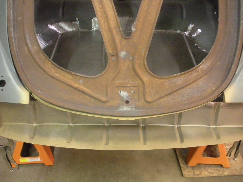 A close up of the front end of an old car.