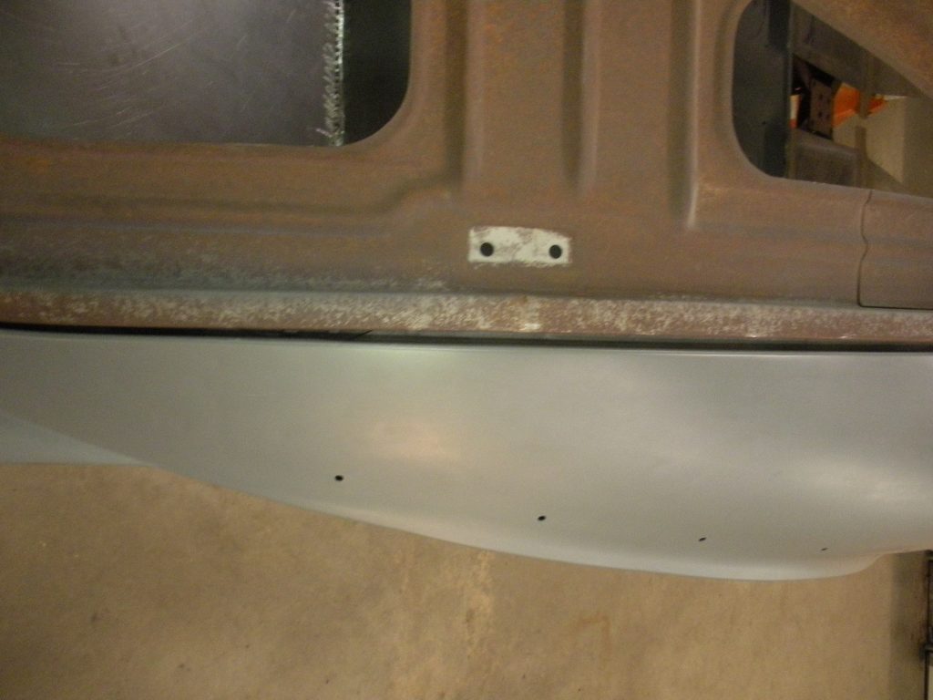 A car door with some metal parts on it