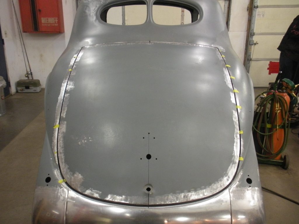 A silver car with some paint on it