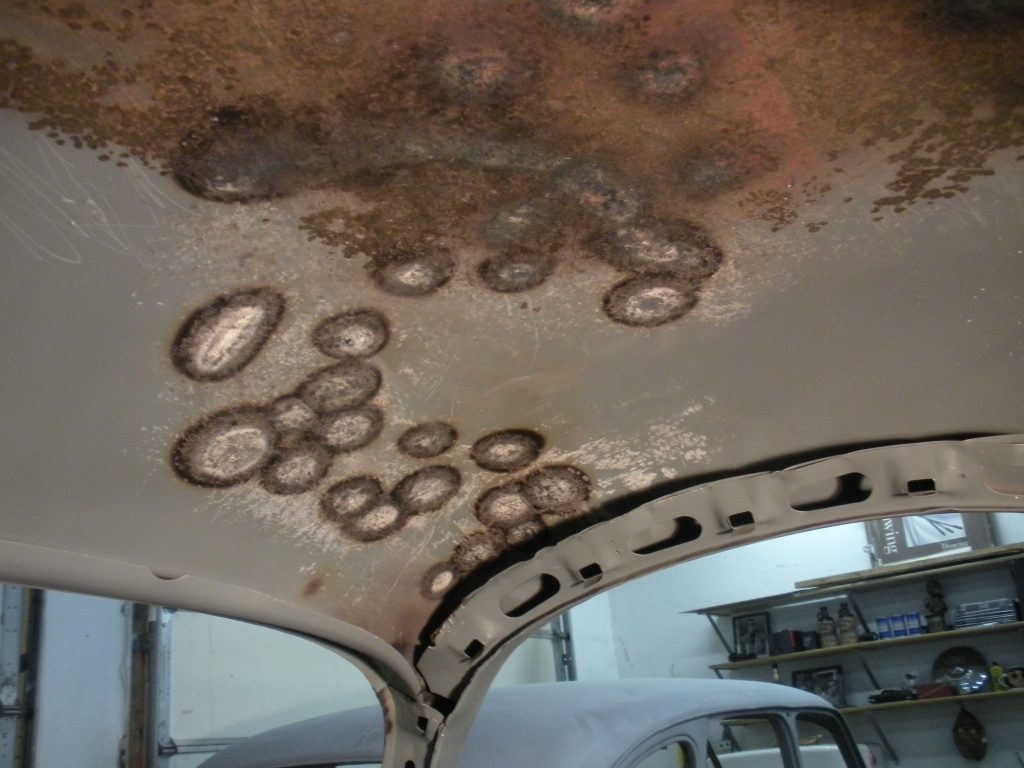 A ceiling with many holes in it