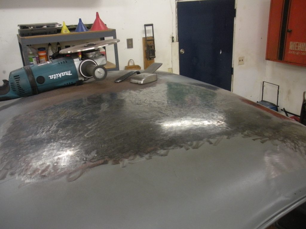A car that is sitting in the garage.