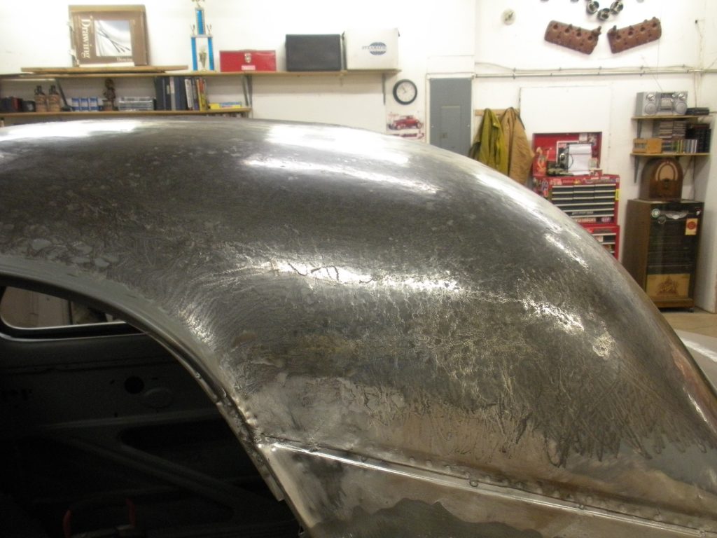 A close up of the rear end of an old car.