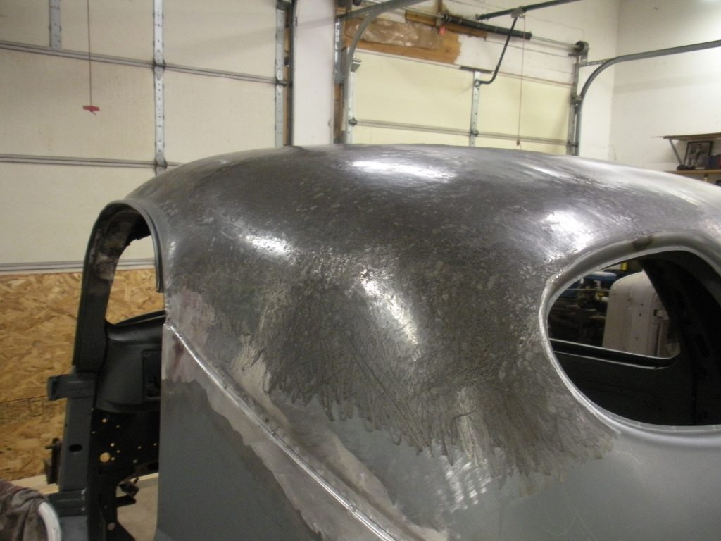 A close up of the side of an old car.